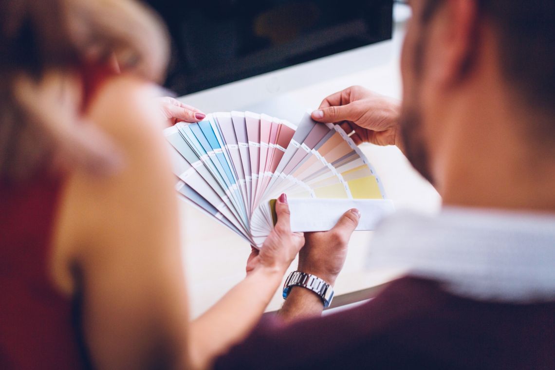 Lamars Home Decorating. Choosing paint colours from colour swatch